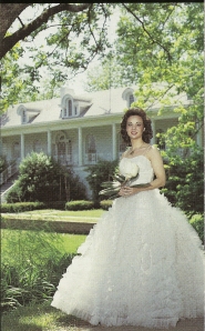 An Arkansas Delta Belle in front of an antebellum home