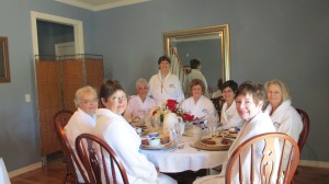 The Clique in their matching white robes at their bed and breakfast inn during their May 1-4 meeting in Tulsa